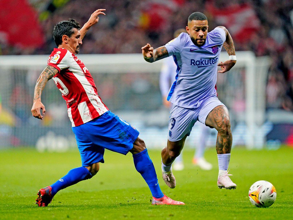 ESP: Atletico de Madrid v FC Barcelona, Barca La Liga Santander Memphis Depay of FC Barcelona and Stefan Savic of Atletico de Madrid during the La Liga match between Atletico de Madrid v FC Barcelona played at Wanda Metropolitano Stadium