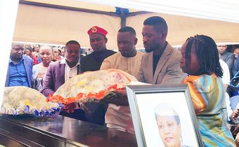 Bobi lays a wreath on the casket of Claire Choppa