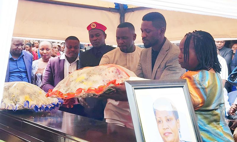 Bobi lays a wreath on the casket of Claire Choppa