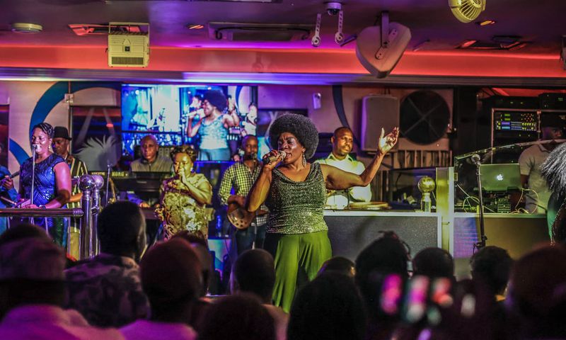 At exactly midnight, the band turned up the ante, with Rachael Magoola taking the lead on vocals.