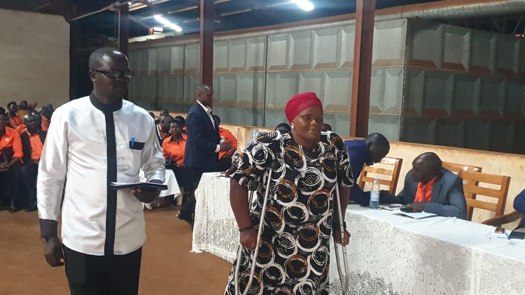 Betty Kaali (with crutches) has emerged winner.