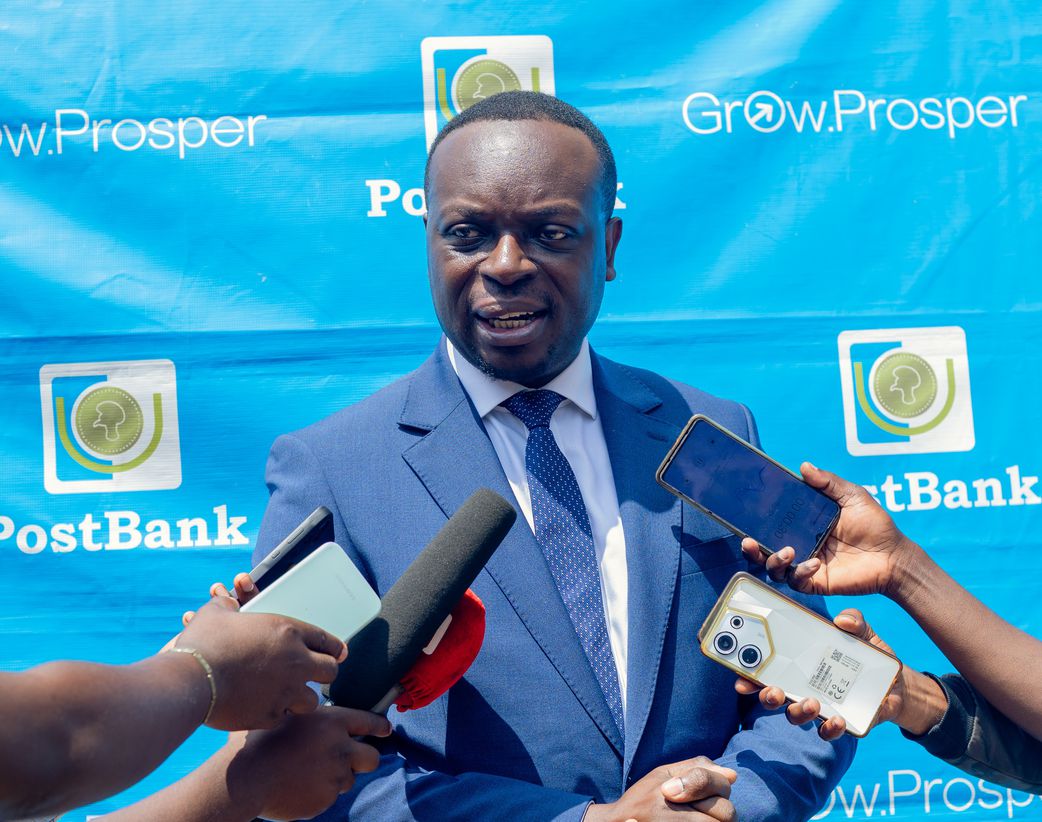 PostBank Uganda Managing Director Julius Kakeeto addressing the media