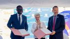 H.E. Virginie Leroy (2nd L), Ambassador of France to Uganda, PostBank Uganda Managing Director Julius Kakeeto (2nd R), and Marc Trouyet, the Country Director for AFD in Uganda, during the MoU exchange
