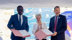 H.E. Virginie Leroy (2nd L), Ambassador of France to Uganda, PostBank Uganda Managing Director Julius Kakeeto (2nd R), and Marc Trouyet, the Country Director for AFD in Uganda, during the MoU exchange