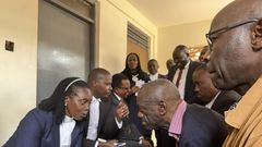 Besigye consults with his legal team