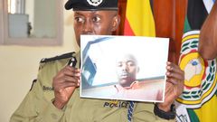 Police spokesperson Kituuma Rusoke displays the photo of Police Constable Charles Bahati in December (Photo courtesy: Nile Post)