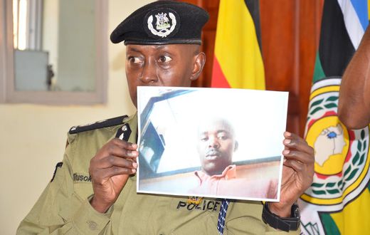 Police spokesperson Kituuma Rusoke displays the photo of Police Constable Charles Bahati in December (Photo courtesy: Nile Post)