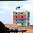 Museveni watches a chopper driill at the passing out event