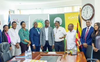 Minister Martin Mugarra poses with the Rwenzori Marathon team along with officials from the Ministry and UWA