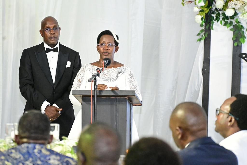 The couple addressing the guests