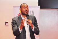 UIA Director General Robert Mukiza addressing Kikuubo traders in Kampala