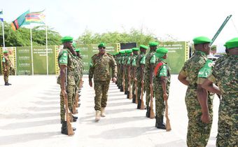 Lt. Gen. Sam Kavuma was accorded a guard of honour by UPDF troops at the ATMIS headquarters