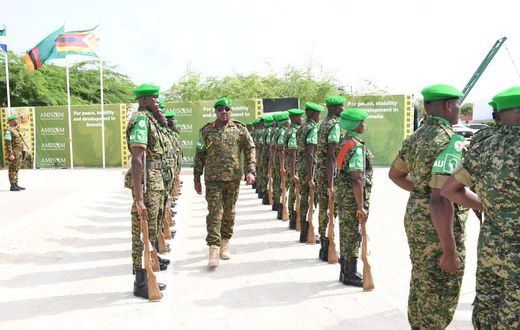 Lt. Gen. Sam Kavuma was accorded a guard of honour by UPDF troops at the ATMIS headquarters