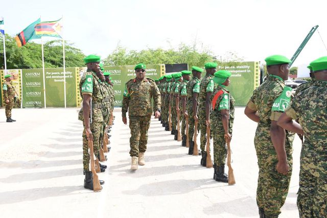 Lt. Gen. Sam Kavuma was accorded a guard of honour by UPDF troops at the ATMIS headquarters