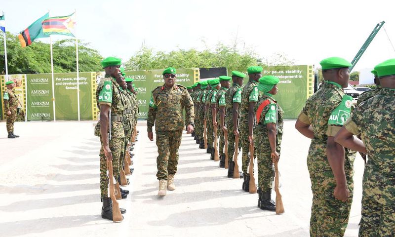 Lt. Gen. Sam Kavuma was accorded a guard of honour by UPDF troops at the ATMIS headquarters