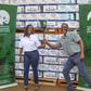 Pearl Nimusiima, the Public Affairs and Communications Manager of CCBU and Amos Wekesa, the Tusker Lite Mt.Rwenzori Marathon  Team Leader  pose for a photo during the Launch of the CCBU Mt. Rwenzori partnership
