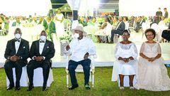 Museveni poses for a photo with Atwiine and her husband