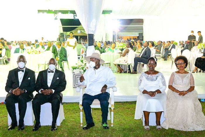 Museveni poses for a photo with Atwiine and her husband