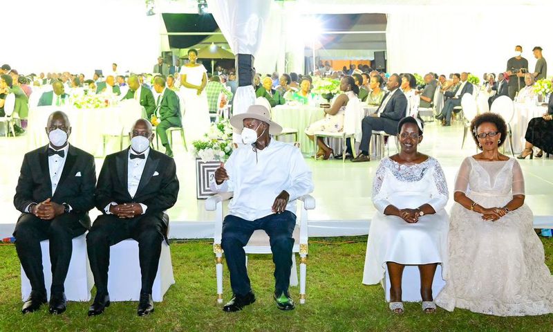 Museveni poses for a photo with Atwiine and her husband