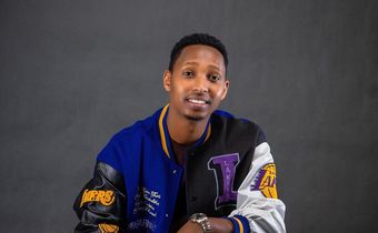 Israel Mbonyi in a Lakers jacket, the Rwandan gospel artiste is an avid reader and basketball fan