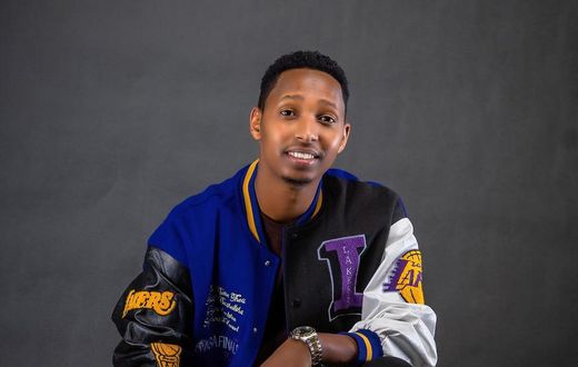 Israel Mbonyi in a Lakers jacket, the Rwandan gospel artiste is an avid reader and basketball fan