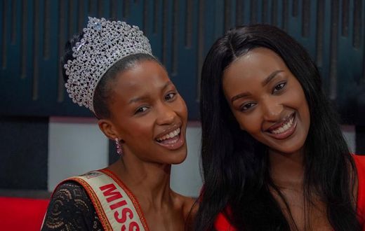 Natasha Nyonyozi poses with the outgoing Miss Uganda Hannah Karema