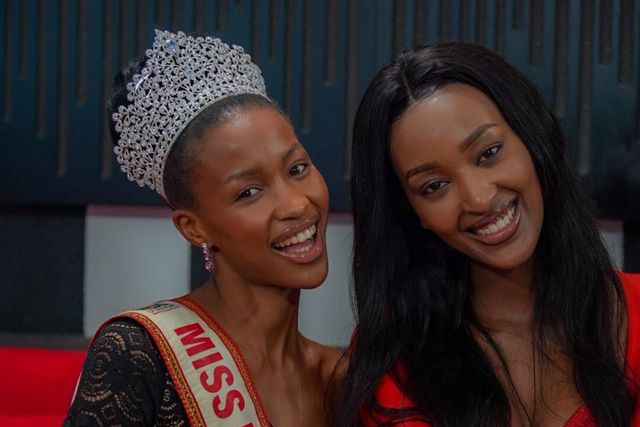 Natasha Nyonyozi poses with the outgoing Miss Uganda Hannah Karema