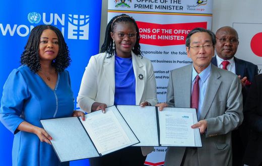 Minister Lillian Aber with Japanese Ambassador to Uganda, Sakayama Takuya and Paulina Chiwangu, the UN Women countyr Rep at the signing