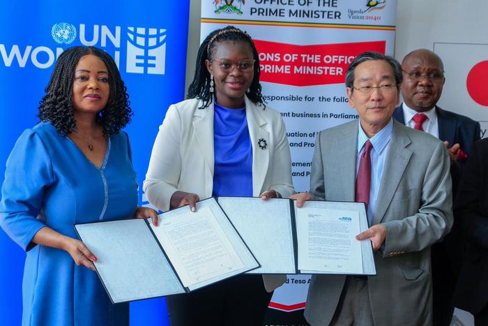 Minister Lillian Aber with Japanese Ambassador to Uganda, Sakayama Takuya and Paulina Chiwangu, the UN Women countyr Rep at the signing