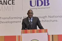 The Bank of Uganda Gorvnor Dr.Michael Atingi-Ego adresses delegates at the recently concluded UDB summit held at Speke Resort convention center Munyonyo
