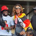 Ritah Kaggwa on arrival draped with Uganda flag