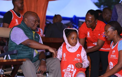 Kabaka Ronald Muwenda Mutebi greets children of Prince David Wasajja before flagging off the 12 Kabaka birthday run at Lubiri in Mengo