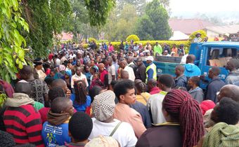 Locals gather at Hoima City mortuary where the bodies were taken