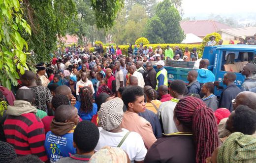 Locals gather at Hoima City mortuary where the bodies were taken