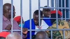 Counsel Eron Kiiza was briefly locked up in the dock with Dr Kizza Besigye and Erias Lukwago before being dragged out of the court room