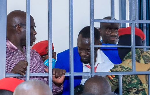 Counsel Eron Kiiza was briefly locked up in the dock with Dr Kizza Besigye and Erias Lukwago before being dragged out of the court room
