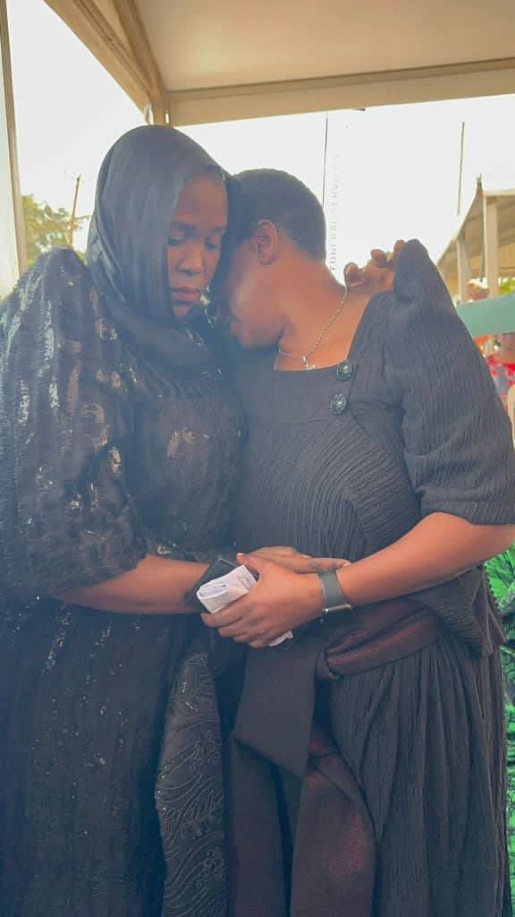 Hon Betty Nambooze consoled by fellow MP Shamim Malende