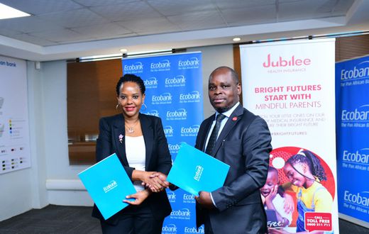 Jubilee Health Insurance CEO, Dan Musiime with Grace Muliisa, Managing Director of Ecobank Uganda