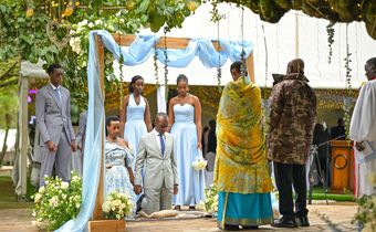 Natasha, Karugire and their children before President Museveni and the First Lady
