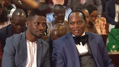 Bobi Wine chats with Mathias Mpuuga at Kabaka's birthday servce