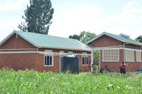 Hon Alice Kaboyo handed over  two new homes to civilian veterans in Nakaseke District.