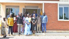 Hon Alice Kaboyo handing over the new home to the family of  the late Yoram Kisuze in Namusaale, Kapeeka, Nakaseke District.