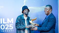 Brian Kabogozza with the accolade he won during the just concluded Uganda Film Festival awards.