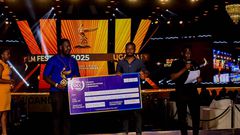 Emma Illungole (L) and Kefa Senoga (R) recieving the Award on behalf of Brian Kabogozza and Douglas Byaruhanga