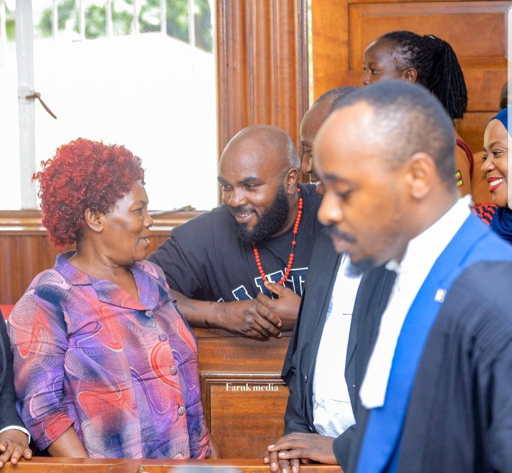 Eddy Mutwe smiles at his mother during his bail hearing