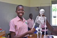 Learners at Buloba Church of Uganda Primary School in Wakiso District experiment with lab equipment