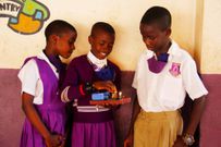 Learners at Buloba Church of Uganda Primary School in Wakiso District experiment with lab equipment