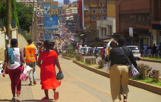 Pedestrians walk on the Kampala’s non-motorized transport corridor. Photo by Richard Hamba/ TEENS Uganda