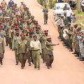 Retirees leaving the MoDVA HQ in Mbuya, waving as a symbol of their departure from active service.