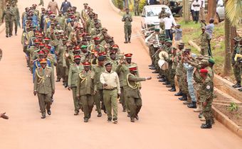 Retirees leaving the MoDVA HQ in Mbuya, waving as a symbol of their departure from active service.
